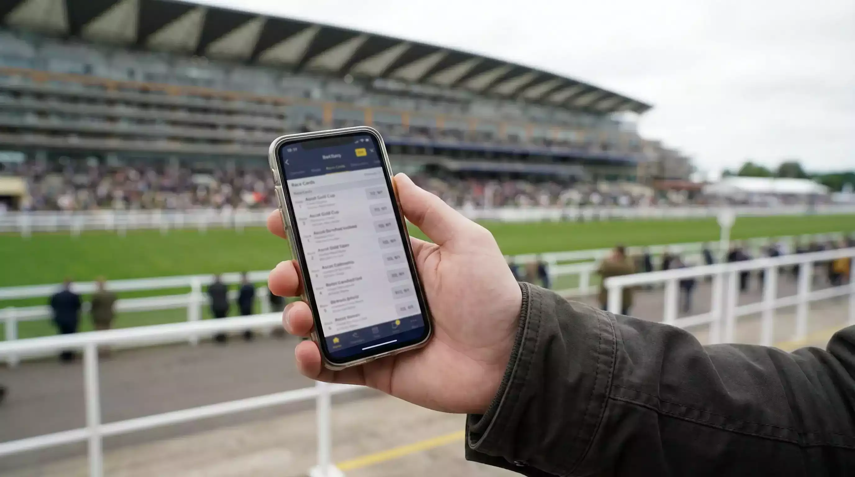 Tela de celular mostrando interface de apostas em corridas de cavalos